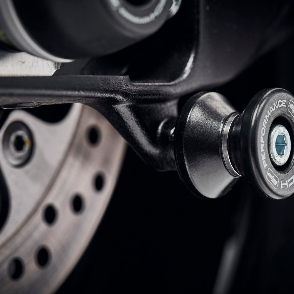 
                  
                    EP Paddock Stand Bobbins fitted to the swingarm of the GSX-S1000F near EP Rear Spindle Bobbins crash protection.
                  
                