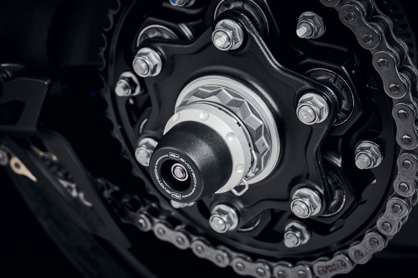 EP Spindle Bobbins Kit is fitted to the rear wheel of the Triumph Speed Triple 1200 RR with nylon bobbin and aluminium spacer clearly fitted, offering robust crash protection to the swingarm and spindle retainer.