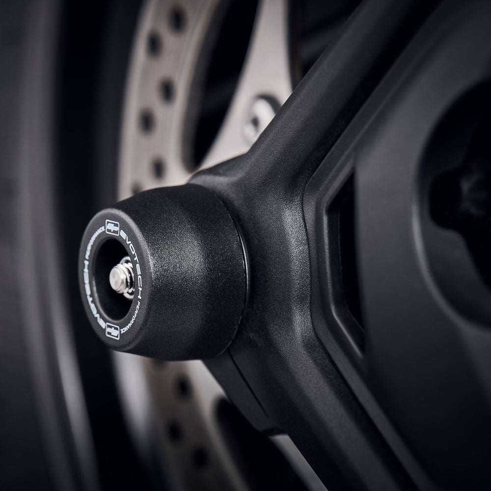 The rear wheel of the Triumph Tiger 1200 GT Pro with the crash slider of EP Rear Spindle Bobbins fitted with precision, offering crash protection to the swingarm and brake calipers.