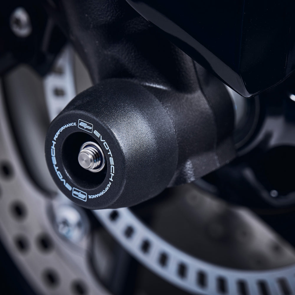 The front fork of the Triumph Tiger Sport 660 fitted with Evotech Performance’s signature crash slider from EP Front spindle Bobbins, safeguarding the forks and brake calipers.