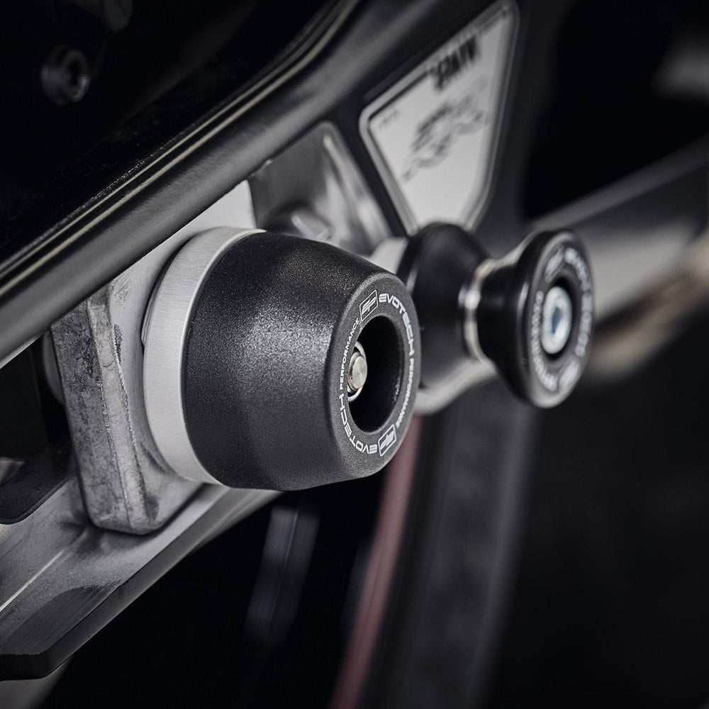 
                  
                    The offside rear wheel of the BMW S 1000 R with EP Spindle Bobbin secured to the swingarm and near EP Paddock Stand Bobbins.
                  
                