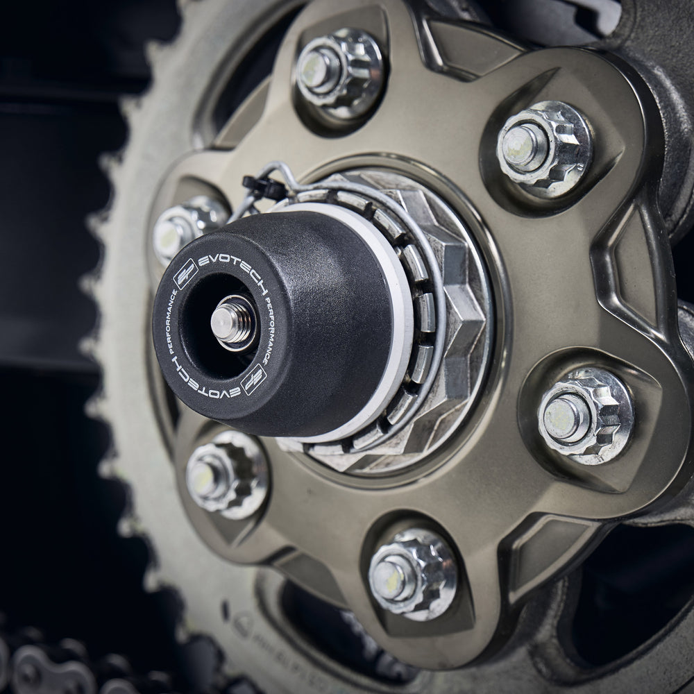 
                  
                    The signature Evotech Performance spindle bobbin fitted to the rear wheel of the Ducati Multistrada 1200 Pikes Peak, offering crash protection to the swingarm and chain.
                  
                