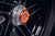 The offside wheel of the KTM 1290 Super Duke R fitted with the anodised orange hub stop of EP Rear Spindle Bobbins crash protection.