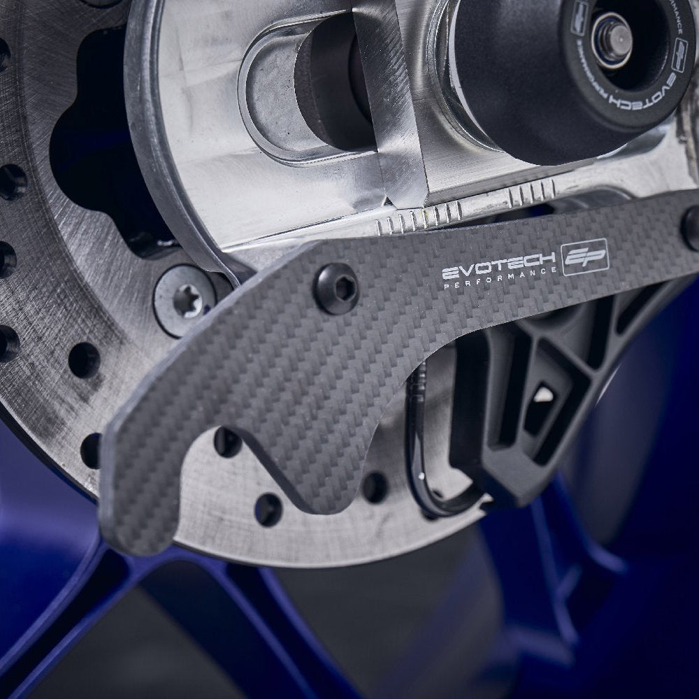 The rear swingarm of the Yamaha YZF-R1M with EP Carbon Fibre Paddock Stand Plates installed, ready to be attached to the paddock stand to elevate the rear wheel.