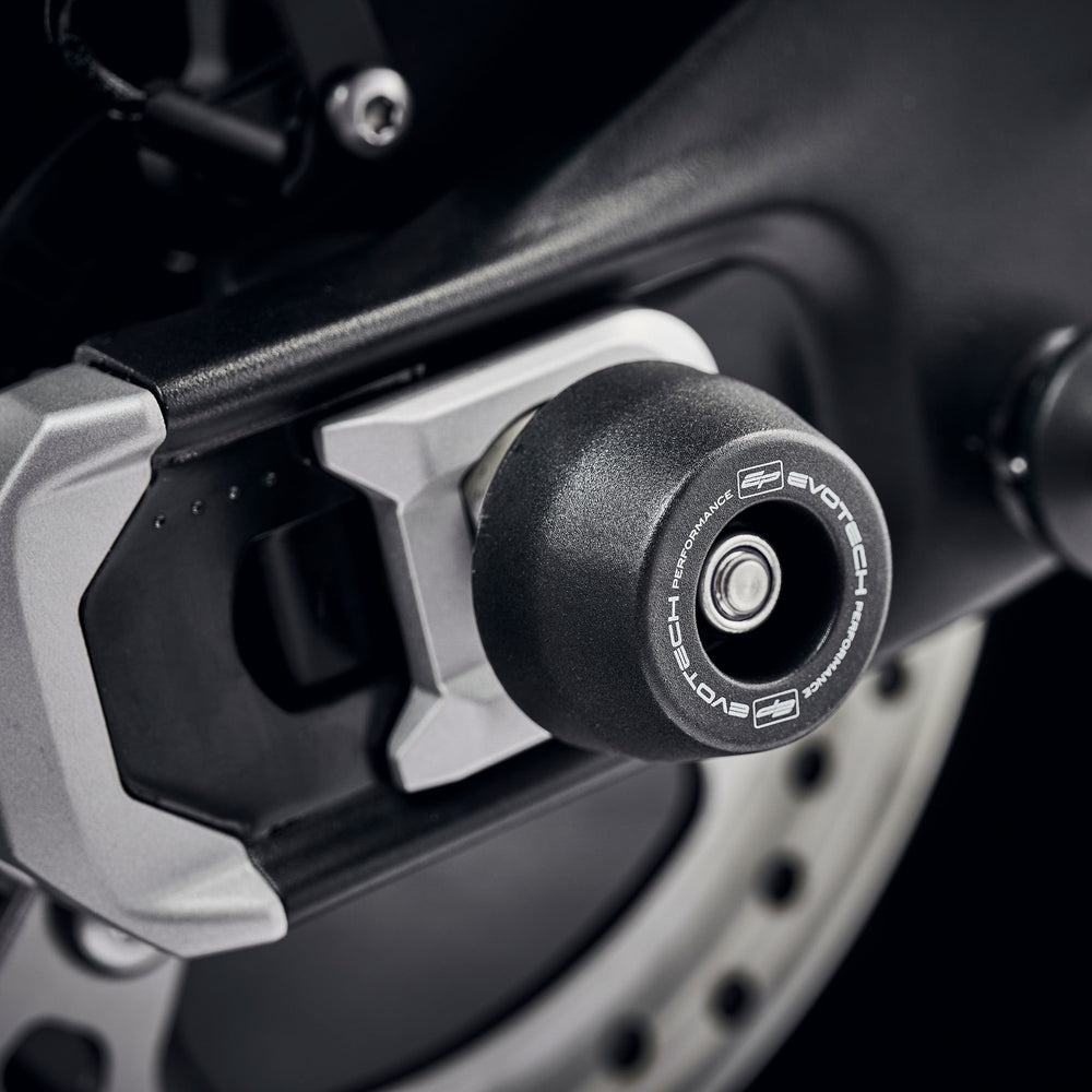 The rear wheel and swingarm of the Triumph Trident with EP Rear Spindle Bobbins installed to give Evotech Performance’s crash protection to the motorcycle’s rear end. 