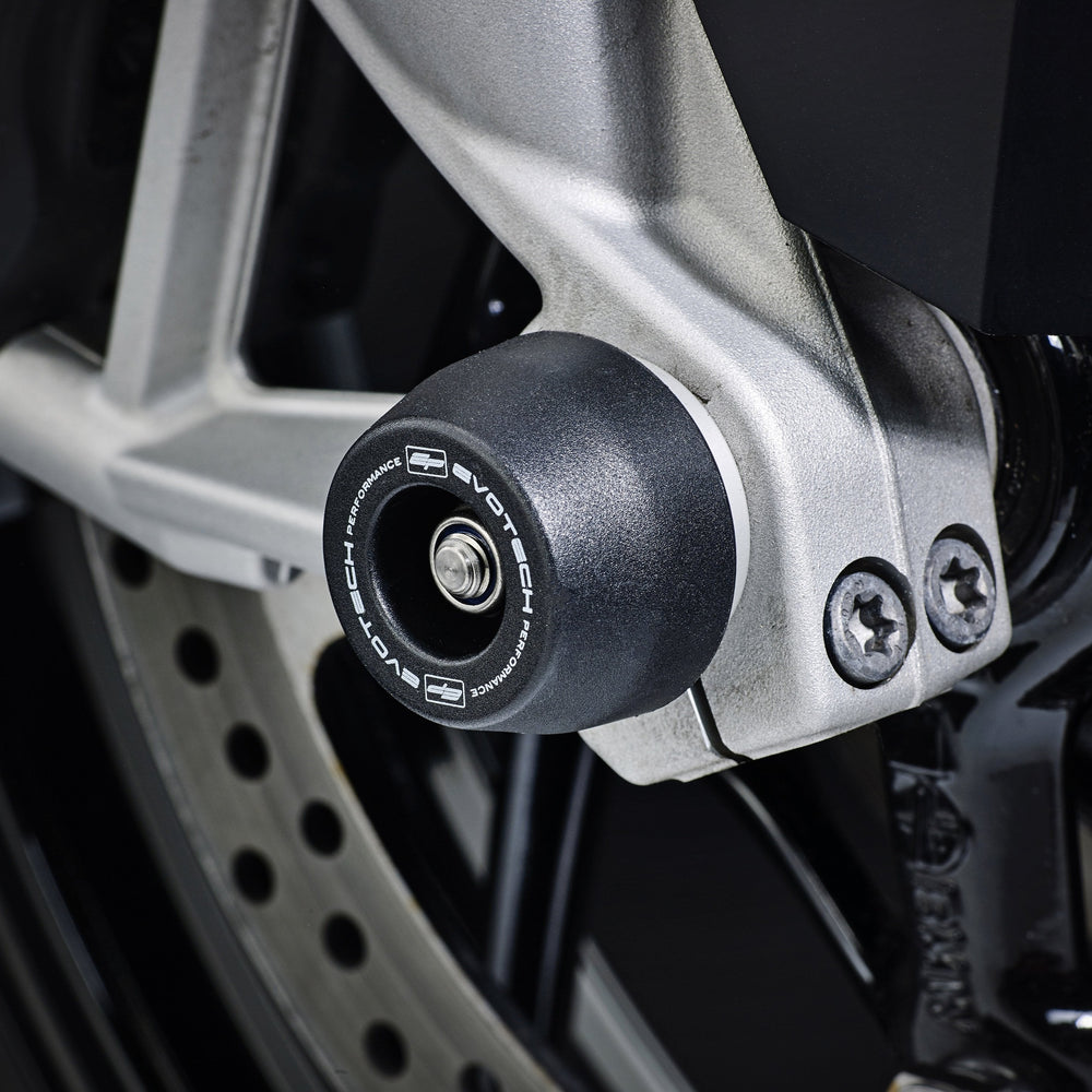 An EP spindle bobbin from EP Spindle Bobbins Kit seamlessly fitted to the front wheel of the BMW S 1000 XR, protecting the front fork and brake calipers.