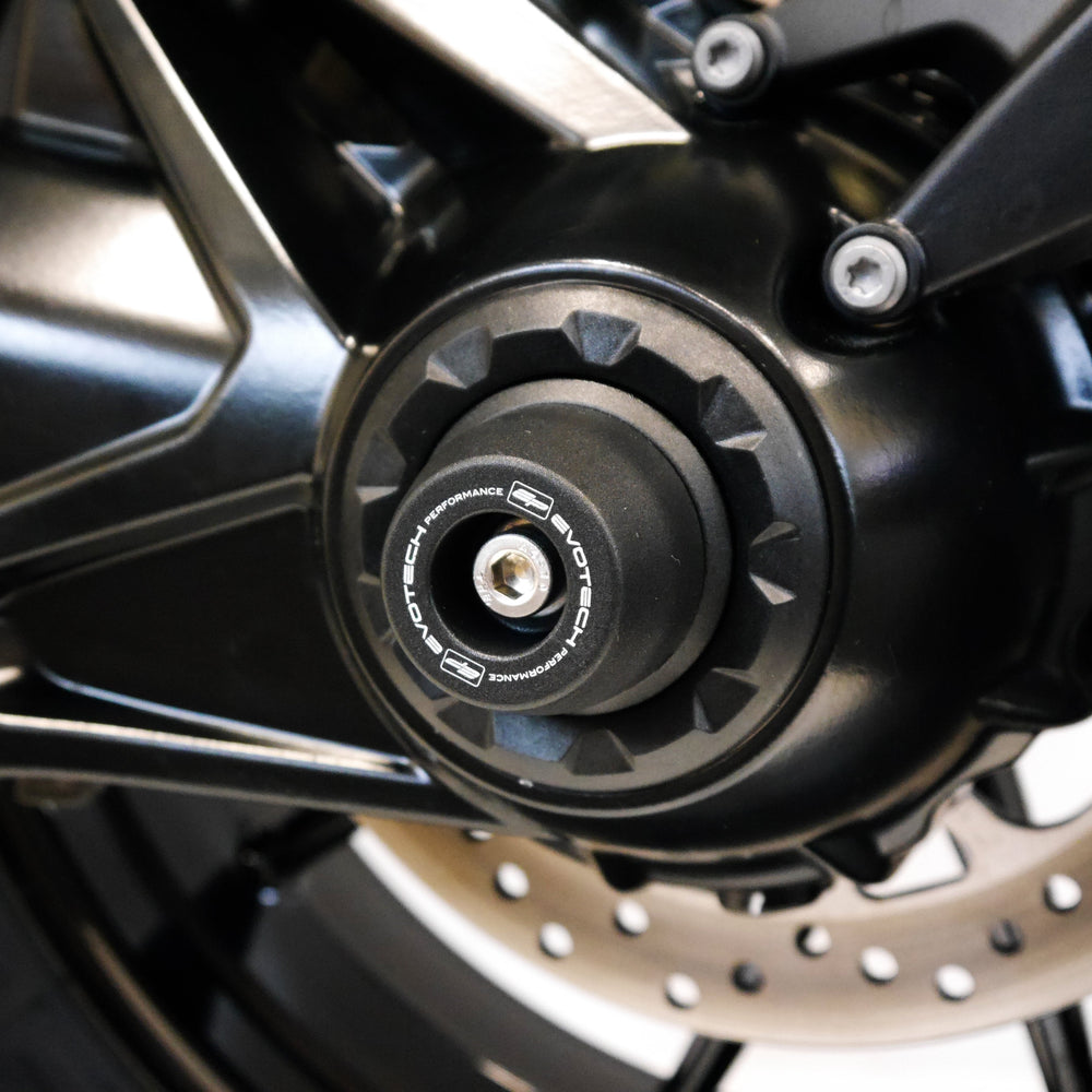 
                  
                    The rear spindle bobbin crash protection projecting from the nearside rear wheel of the BMW R 1250 GS Adventure Rallye.
                  
                