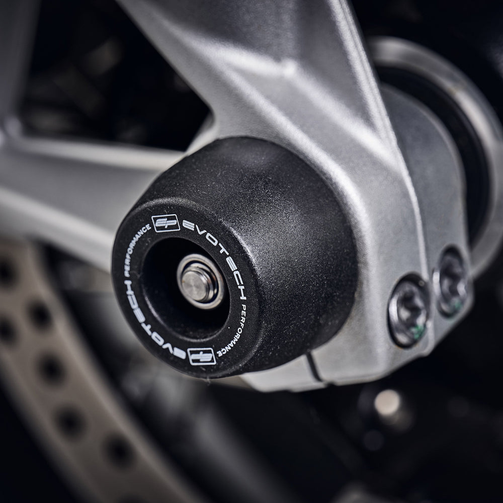 An EP spindle bobbin from EP Spindle Bobbins Kit seamlessly fitted to the front wheel of the BMW F 900 XR, protecting the front fork and brake calipers.