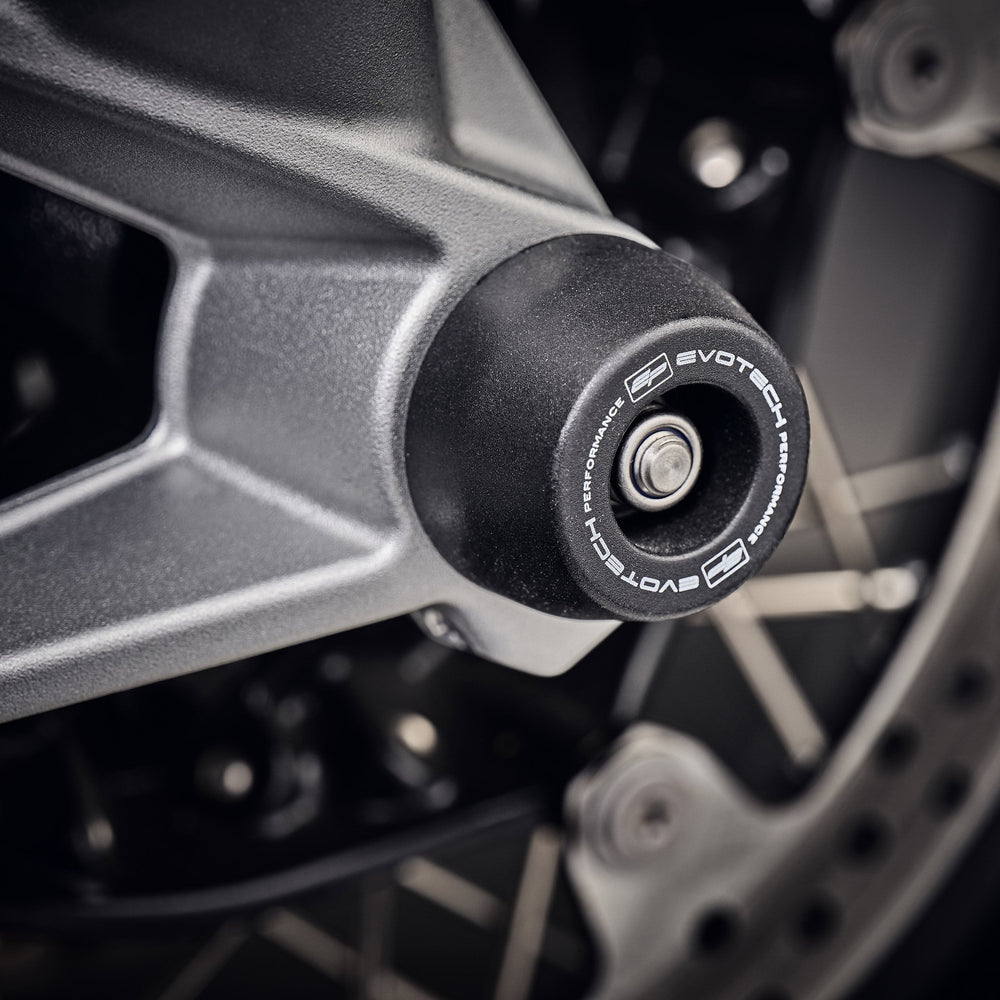 
                  
                    The EP Spindle Bobbins Kit’s nylon bobbin and aluminium reinforcement fitted to the front forks of the BMW F 900 XR.  
                  
                