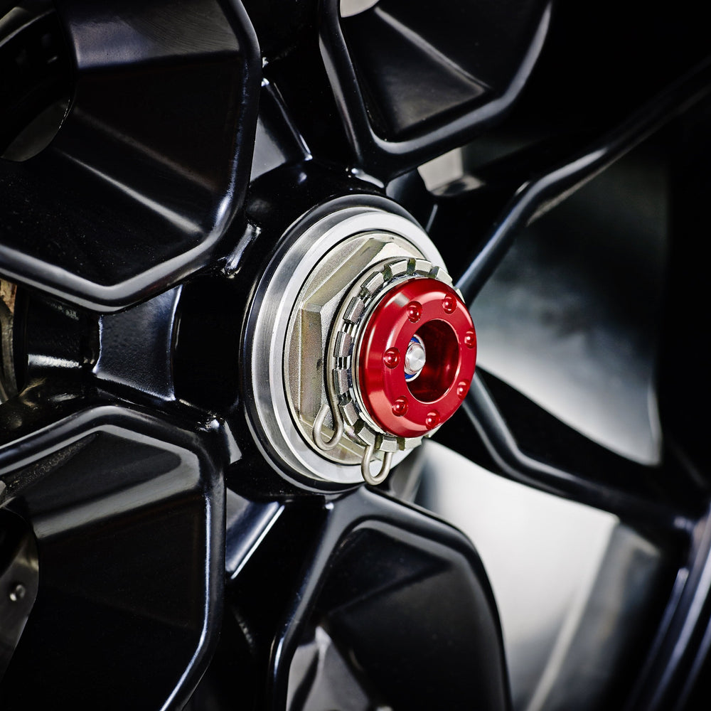 
                  
                    The attractive anodised red hub stop from the EP Spindle Bobbins Crash Protection Kit fitted to the offside rear wheel of the Ducati Hypermotard 950.
                  
                