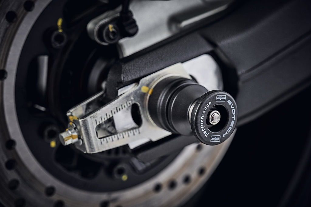 EP Paddock Stand Bobbins fitted to the rear wheel of the Ducati Monster 797, one part of the EP Spindle Bobbins Paddock Kit. 