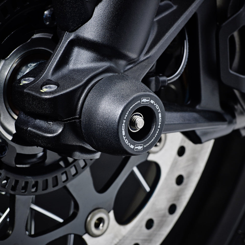 
                  
                    EP Spindle Bobbins Crash Protection Kit fitted to the front wheel of the Ducati Scrambler Icon Dark, guarding the front forks and brake calipers.
                  
                