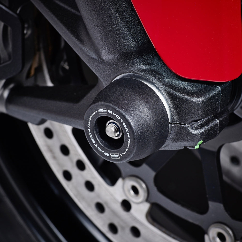 
                  
                    EP Spindle Bobbins Paddock Kit’s front wheel spindle bobbin crash protection fastened in place at the front wheel of the Ducati Scrambler Urban Enduro. 
                  
                