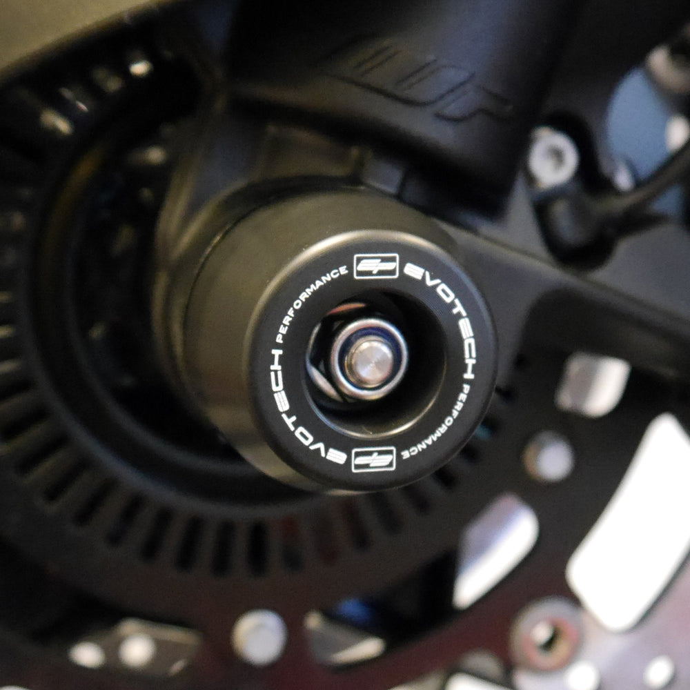 
                  
                    The injection-moulded nylon crash bung of EP Front Spindle Bobbins installed through the front wheel of the KTM 1190 Adventure R, offering strong crash protection to the front forks and brake calipers.
                  
                