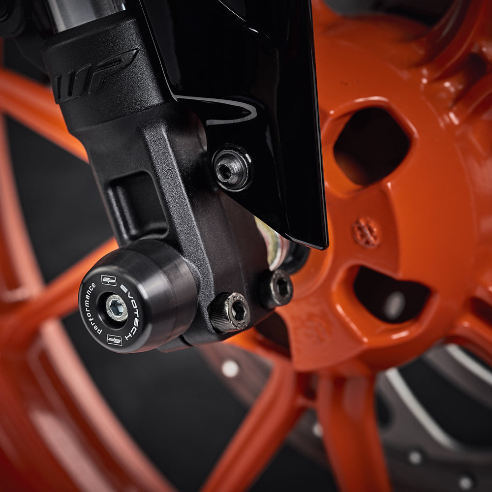 The lower front fork of the KTM RC 200 with EP Front Spindle Bobbins securely attached, offering crash protection to the motorcycleâ€™s front wheel.