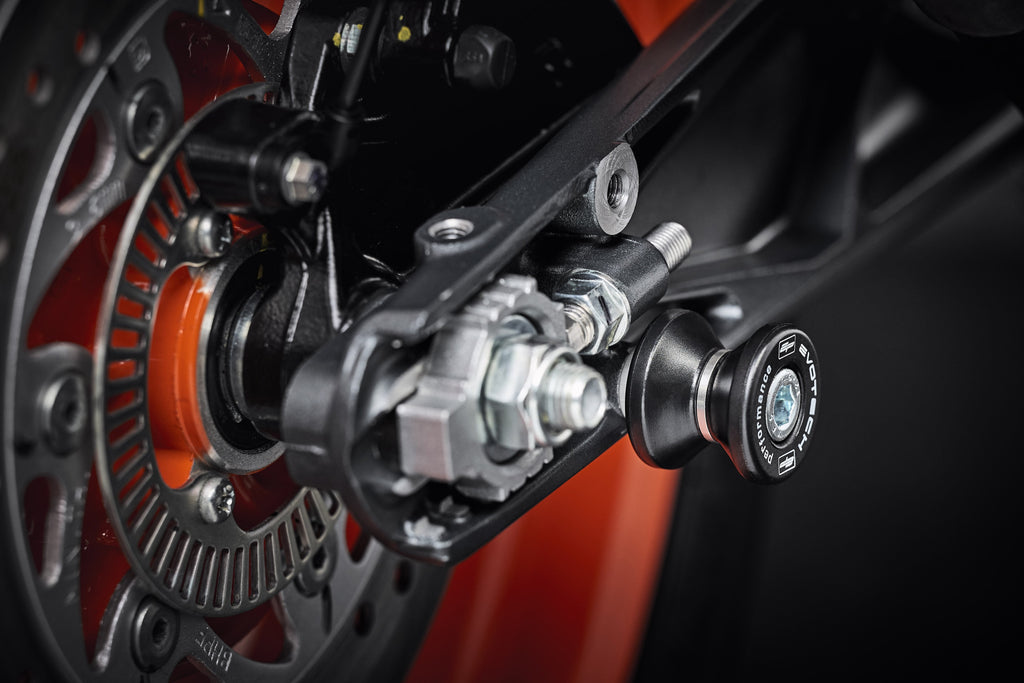 The rear wheel and swingarm of the KTM RC 390, ready to be raised using the installed EP Paddock Stand Bobbins.