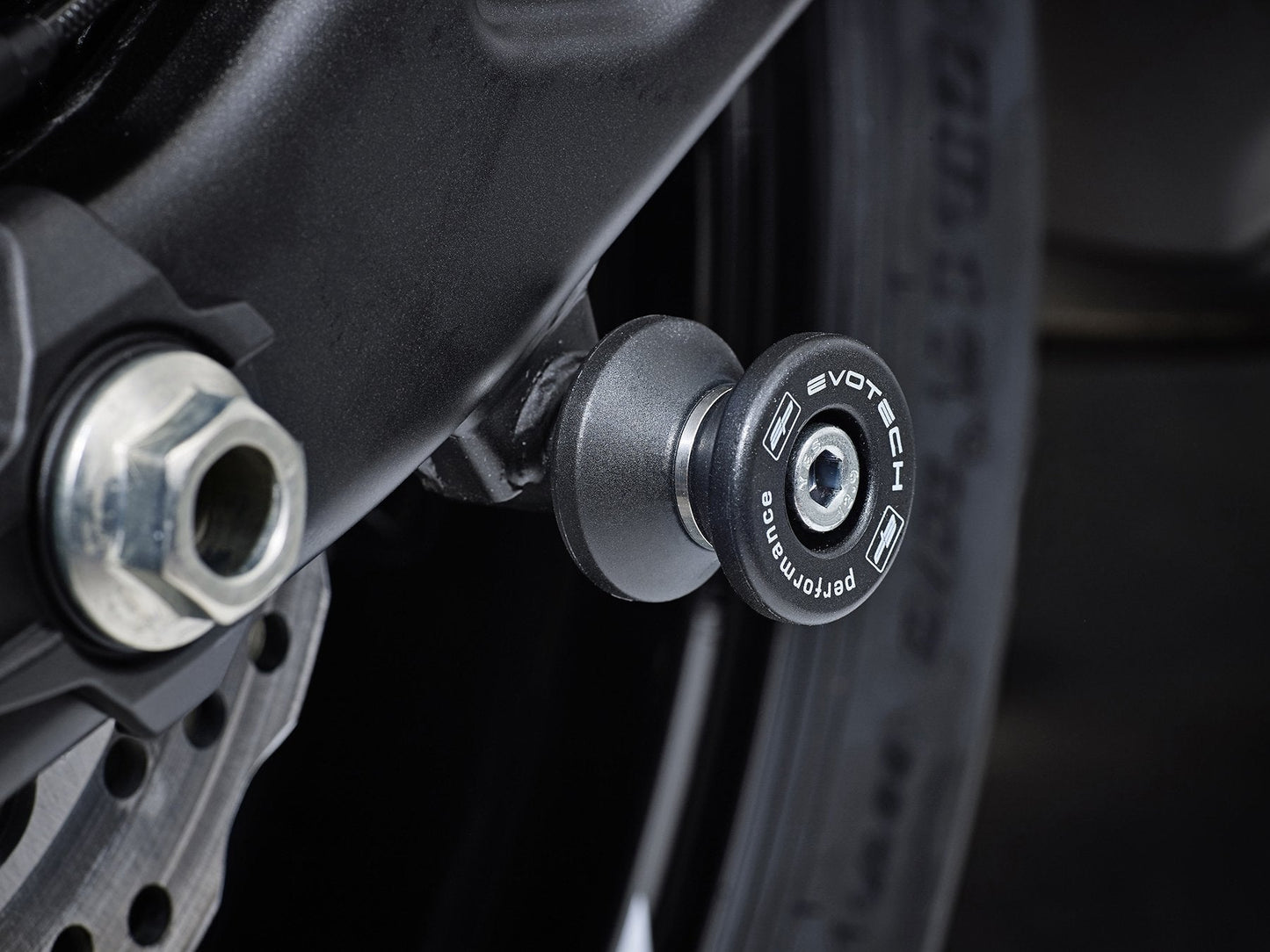 EP Paddock Stand Bobbins inserted into the swingarm of the Kawasaki Ninja 650 Performance.