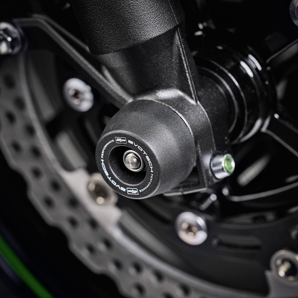 The signature EP Spindle Bobbins Kit precision fitted to the motorcycle, designed to blend with the front forks of the Kawasaki Z900RS.