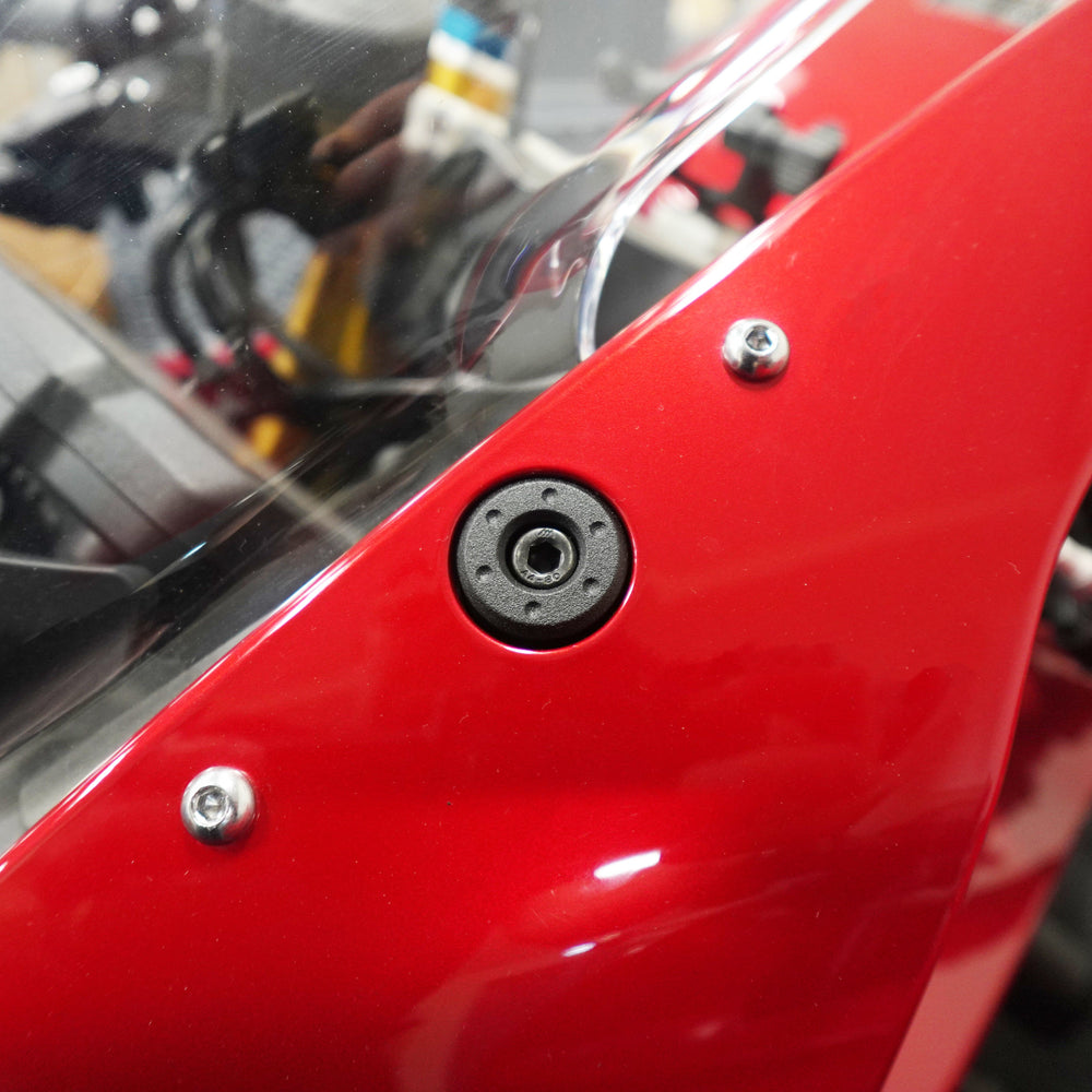 Evotech Mirror Blanking Plates inserted into the front fairing of the motorcycle to plug the original mirror mounting point.