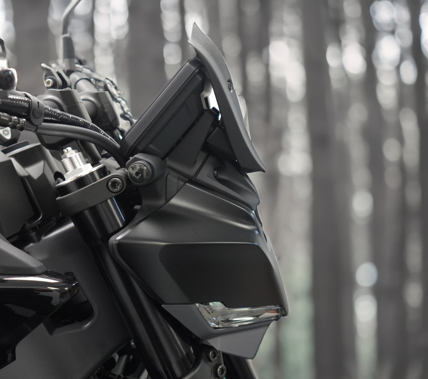 A profile view of the front dash of the Yamaha MT-09 with Evotech Fly Screen motorcycle accessory installed.