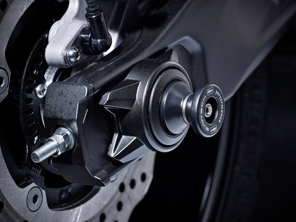 
                  
                    The hourglass shaped paddock stand bobbin from EP Spindle Bobbins Paddock Kit fitted to the rear wheel of the Yamaha YZF-R7.
                  
                