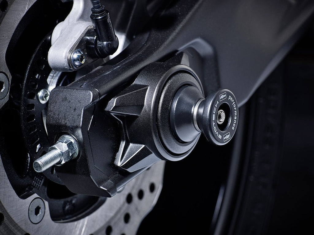 The hourglass shaped paddock stand bobbin from EP Spindle Bobbins Paddock Kit fitted to the rear wheel of the Yamaha YZF-R7.